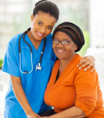 nurse and elderly woman smiling
